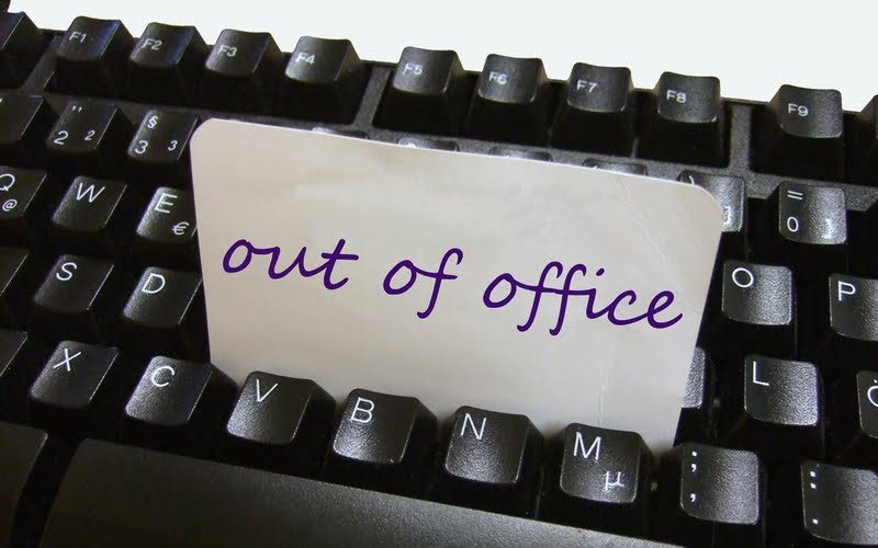 decoration image of a keyboard with a note on top that says "out of office"